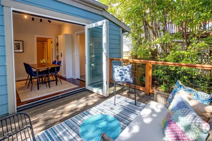 Accordion doors open to private back deck.