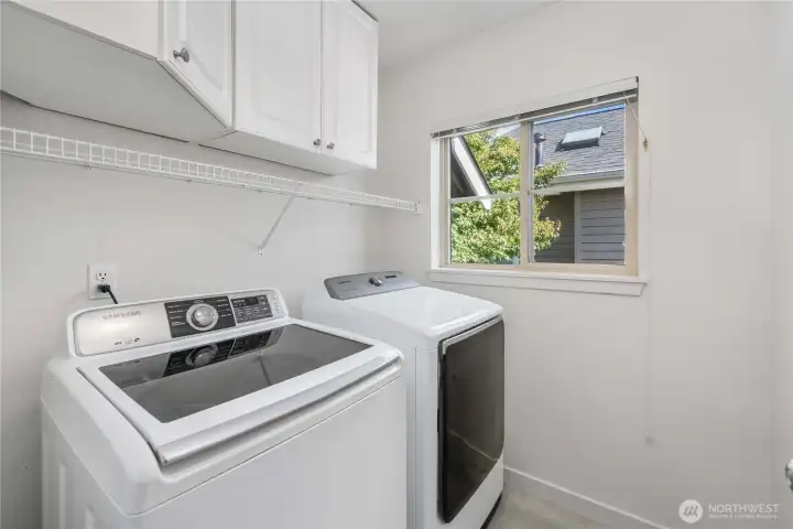 Upstairs laundry room with extra cabinetry
