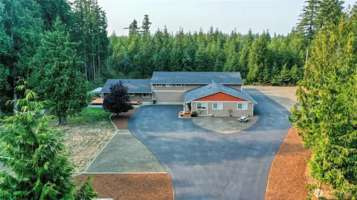 1158 SF 2 Bedroom Home & 1450 SF 2 Bedroom behind the tree on the left with the deck