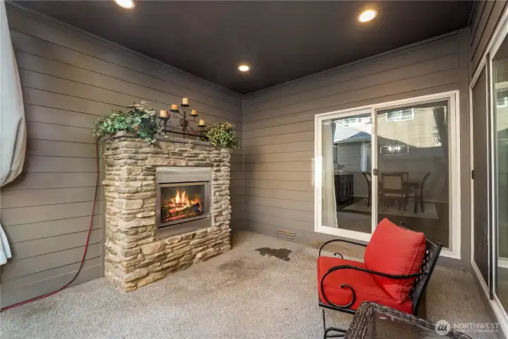 A standout feature, this covered patio includes a striking stone-wrapped fireplace. It creates a cozy outdoor living room you can use year-round, perfect for evening conversations or cool-season entertaining.