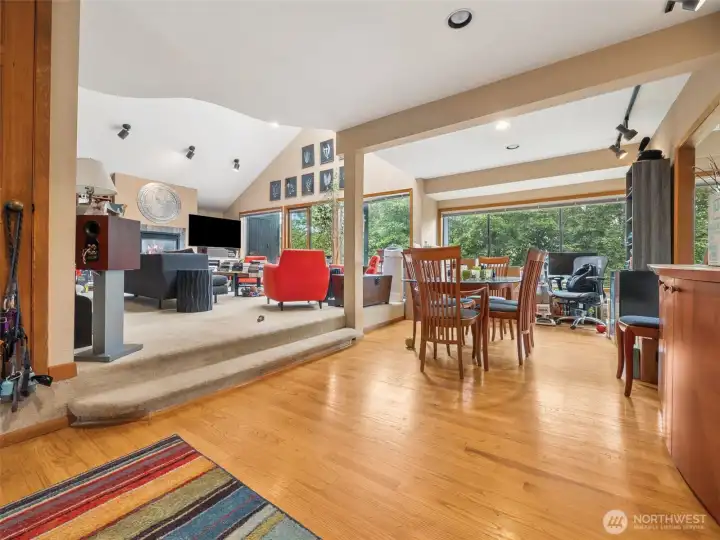Open entry with oak hardwood flooring and coat closet to the left.