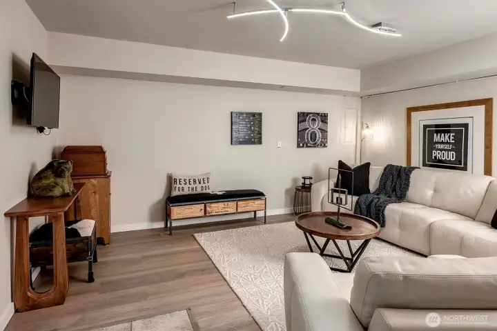 New luxury vinyl wood floors and lighting in bonus room