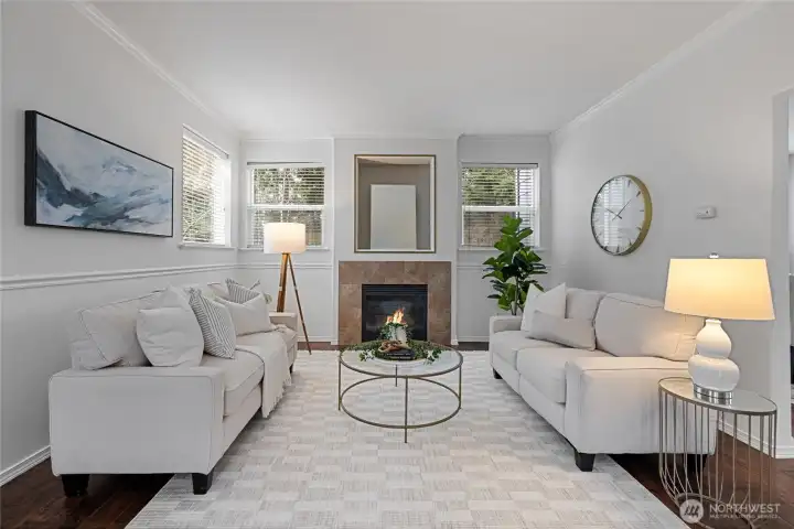 Bright living room featuring a cozy fireplace and abundant natural light