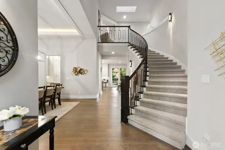 Impressive design to suit today's lifestyle!  Dramatic two story entry with stunning custom staircase and balusters.