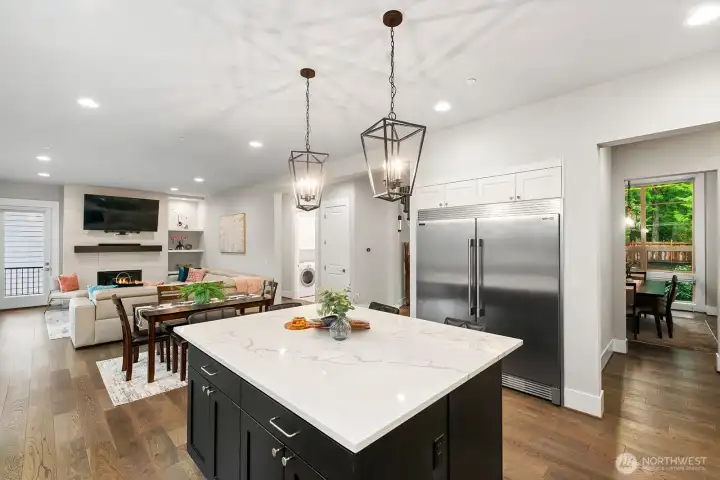Statuario Quartz on island and Mystic Gray Quartz on perimeter countertops.