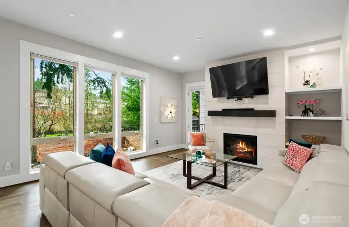 Extraordinary family room boasts soaring ceilings and a wall of windows!