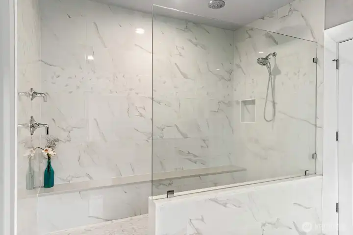 Generously sized shower in primary bathroom.
