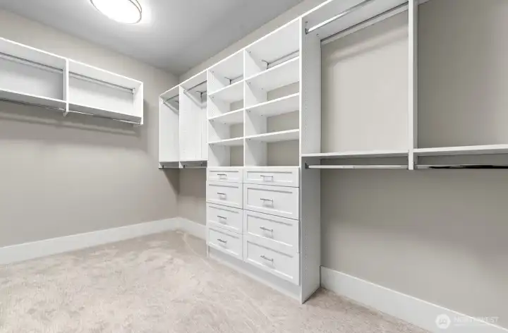 Custom walk-in closet as part of the primary bedroom suite.
