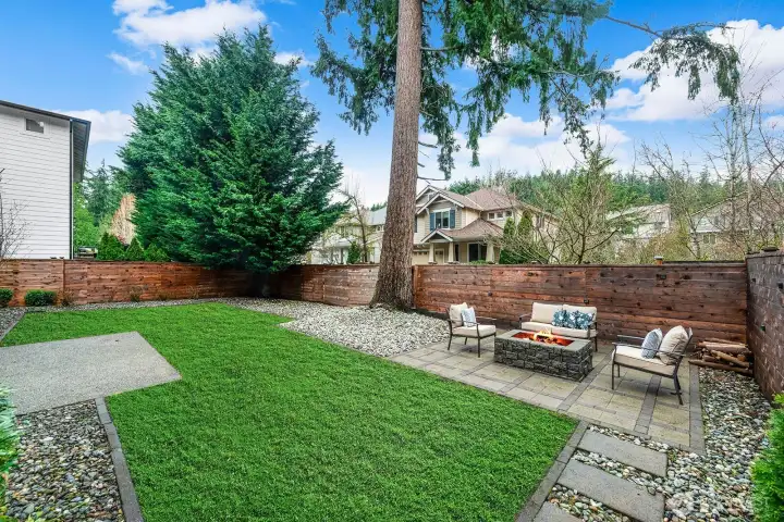 New landscaping with separate back patio.  Private, fully fenced back yard with custom fencing. Please note: Lawn is photo shopped. Front and back lawn have been re-seeded and fertililzed.