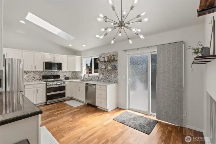 Beautifully updated kitchen with slider out to back deck.