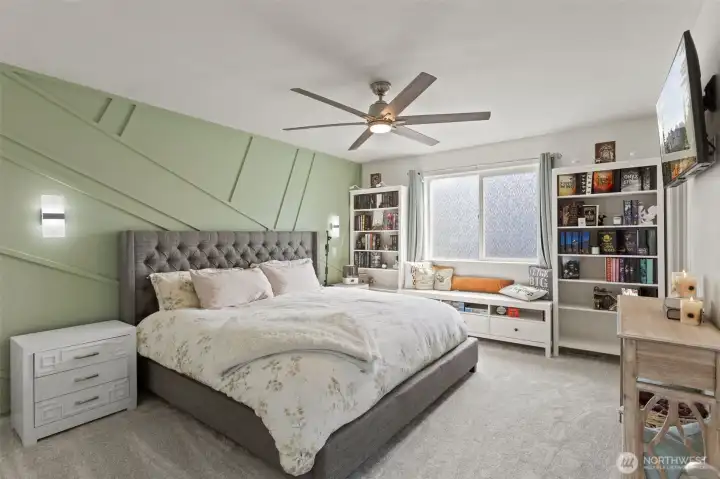 2nd floor primary suite.  Gorgeous custom trim on walls.