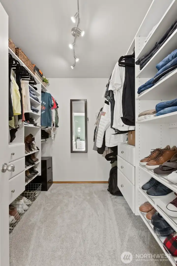 Spacious walk-in closet for primary bedroom.