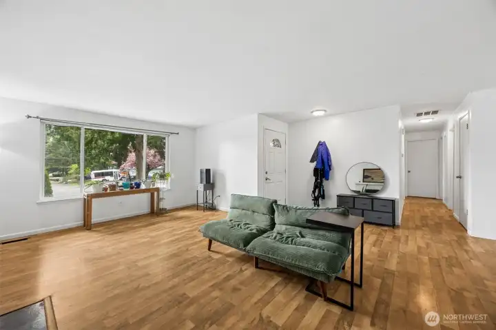 Extra large front window is a great spot for plants or a pet perch.