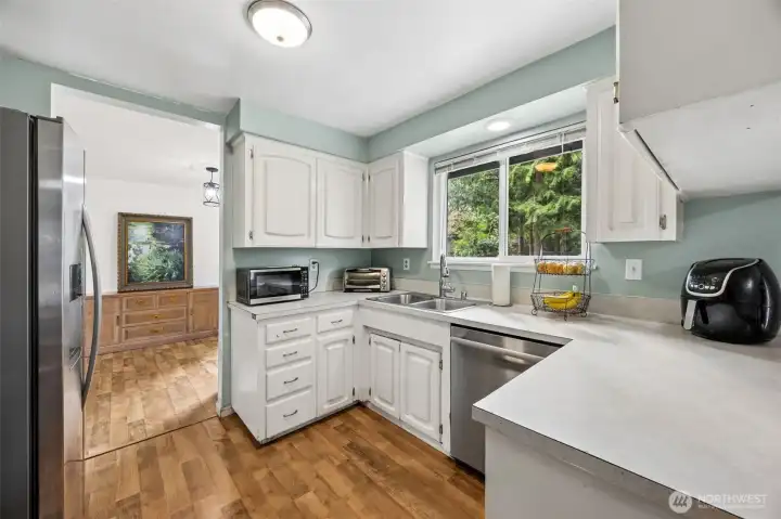 Appliances all stay. Nice window above the sink looking in to the massive park-like back yard.