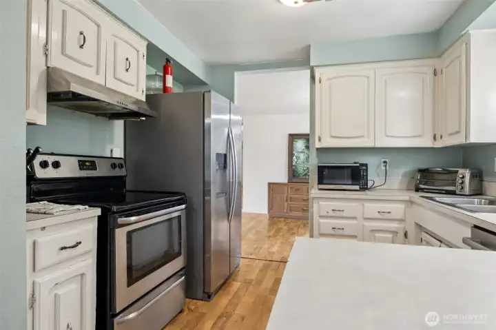 Bright and happy kitchen with the same easy care laminate throughout the main living spaces.