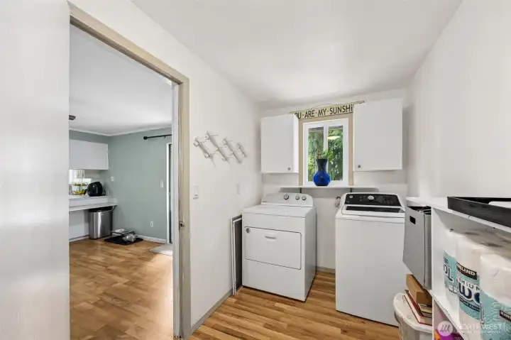 Utility room off in between the second living space and the garage. Extra space for storage or make it a mud room.