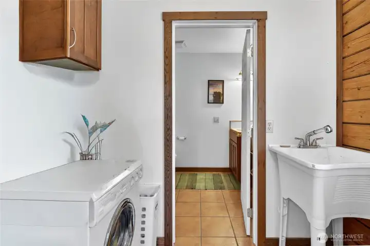 Utility room leading to the 3rd bathroom with a walk-in shower. Utility room leading to the 3rd bathroom with a walk-in shower.