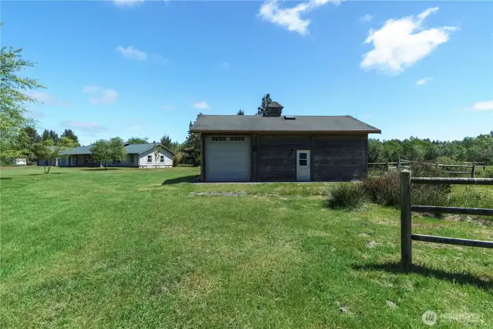Horse stables with tall garage door for trailer storage Horse stables with tall garage door for trailer storage