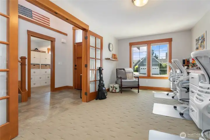 This room is very functional and can be used as a sitting room, large office or study room.