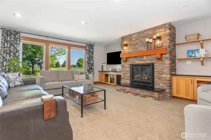 The living room is spacious with a great view into the backyard.