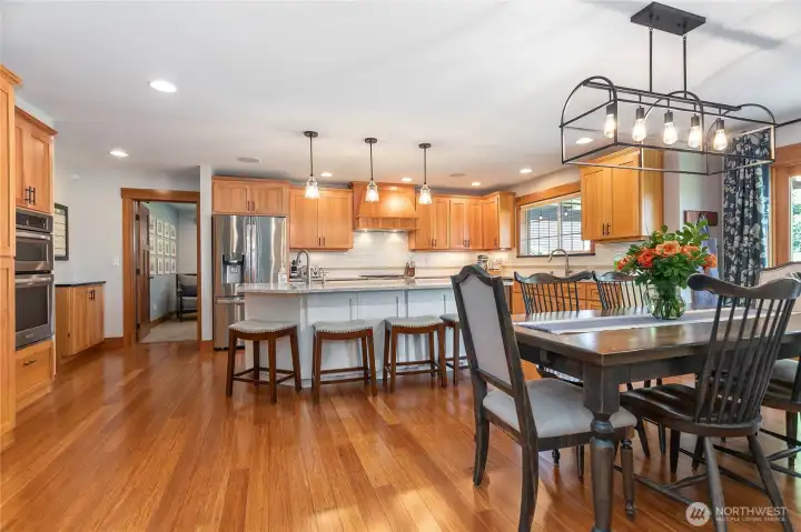 The door to the left of the refrigerator leads to a bonus family room.
