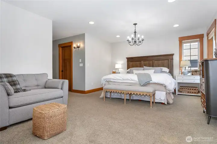 The opening to the left leads to the walk-in closet and the primary bathroom.