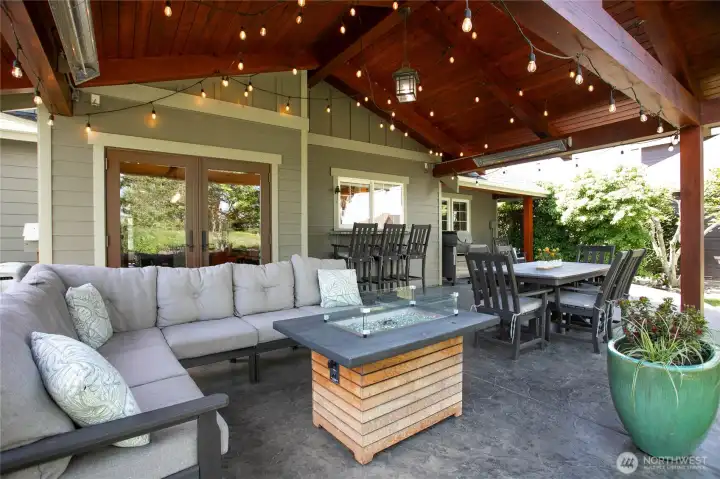 The patio has heaters to take the edge off of the chilly evenings.  There is a pass through serving window located in front of the 3 chairs and a BBQ area on the far right hand side.