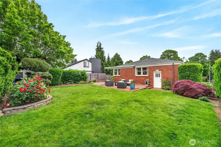Flat back yard with western exposure, fronts Findlay and abuts a paved alley.