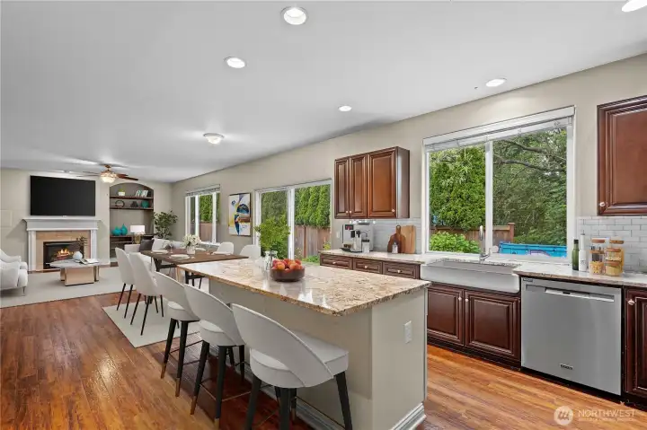 Beautifully virtually staged kitchen, showcasing the open flow, expansive counter space, and premium new appliances Beautifully virtually staged kitchen, showcasing the open flow, expansive counter space, and premium new appliances