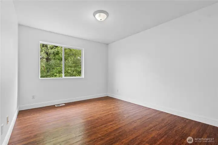Lovely fourth bedroom, offering a versatile space that easily fits a full bedroom set or can adapt into a perfect secondary home office or hobby room Lovely fourth bedroom, offering a versatile space that easily fits a full bedroom set or can adapt into a perfect secondary home office or hobby room