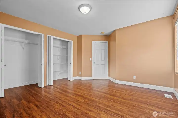 Incredibly spacious secondary bedroom—large enough to serve as a second primary suite or bonus room, featuring dual closets for exceptional storage space Incredibly spacious secondary bedroom—large enough to serve as a second primary suite or bonus room, featuring dual closets for exceptional storage space