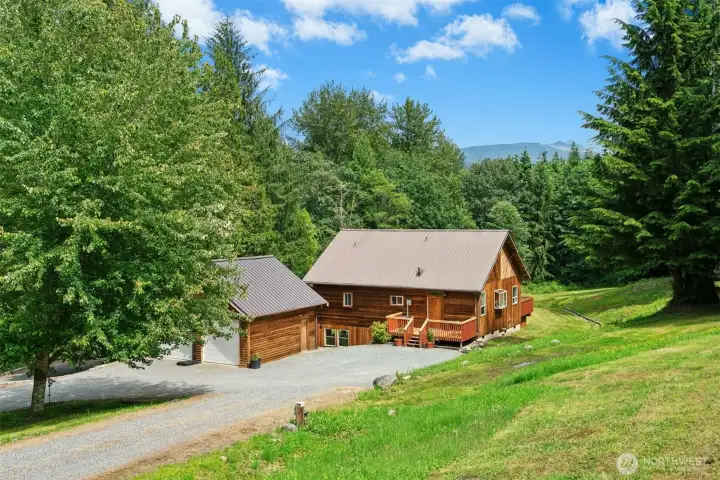 Secluded and beautifully maintained 10.84-acre forested retreat spread over 2 tax lots