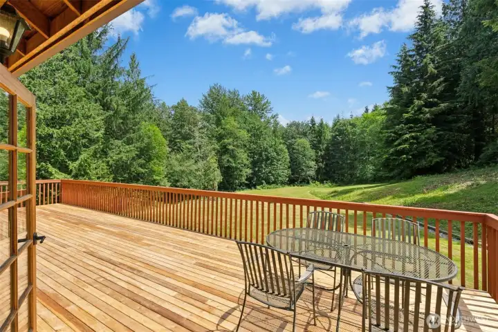 New cedar deck overlooking sprawling back lawn