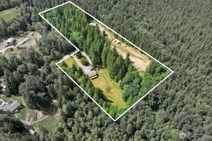 Borders Washington Department of Natural Resources land along the north and west boundaries, offering unparalleled privacy & seclusion