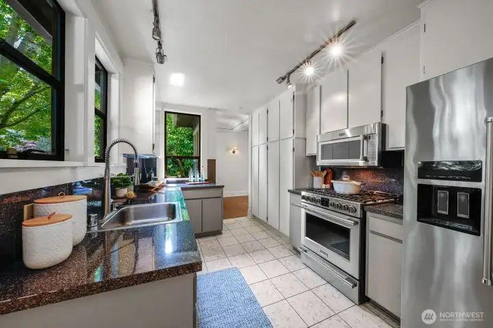 Easily accessible from the dining room, this kitchen, with its newer high-end appliances is ready for any chef.
