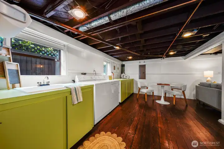 Hard wood floors and exposed beams allows this area to be a blank canvas for the next lucky owners.