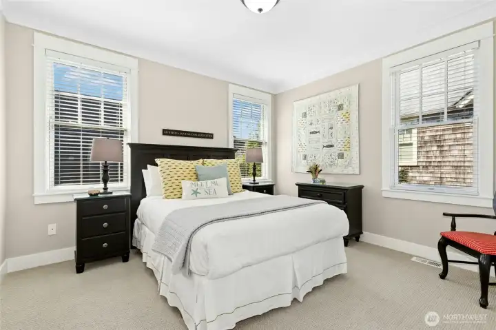 Bedroom three on the second floor offers a view of the patio below, with a full hall bath close by. Bedroom three on the second floor offers a view of the patio below, with a full hall bath close by.