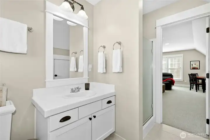 A convenient three-quarter bath serves the third-floor loft, making the space versatile and guest-ready. A convenient three-quarter bath serves the third-floor loft, making the space versatile and guest-ready.