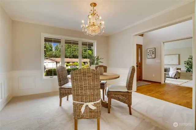 Formal dining room to the right opens to the halls and the entrance for a fabulous entertaining flow.