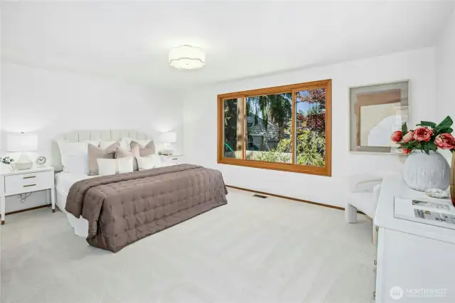 Spacious primary bedroom on the upper level. All NEW interior paint - April 2025. All NEW plush carpet - May -2025