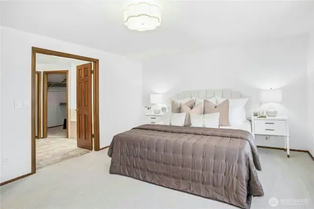 French doors opn to a spacious 5 piece ensuite, featuring a soaking tub, large shower with tile surround, dual sinks, skylight and generous walk-in closet.