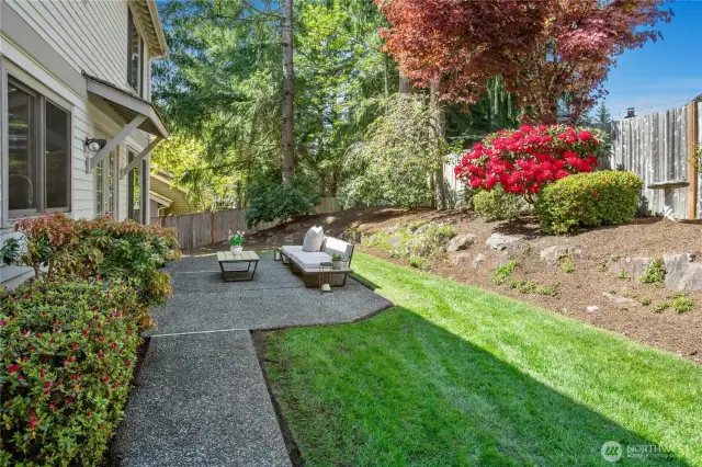 Step outside into your sunny, private backyard oasis—a true entertainer’s dream. With lush landscaping, abundant flat lawn space, and ample room for dining, play, or simply relaxing in the sun, this outdoor sanctuary is ideal for summer gatherings or tranquil evenings under the stars.