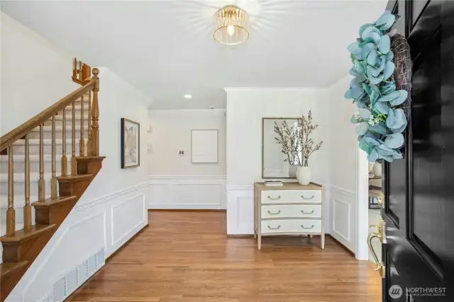 Inside, timeless elegance meets modern comfort. Rich, gleaming hardwood floors, exquisite granite surfaces, soaring, beamed ceilings, and classic built-ins create a sense of refinement and warmth throughout. Open, airy living spaces are filled with natural light, framed by walls of oversized windows, and highlighted by timeless millwork and custom finishes at every turn.