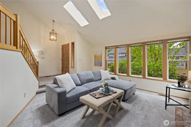 Living Room with wall of windows.  Lots of natural light!