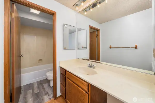 Primary bath with separate tub/shower and commode.