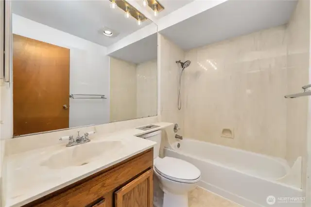 Full bath with tub/shower combo.