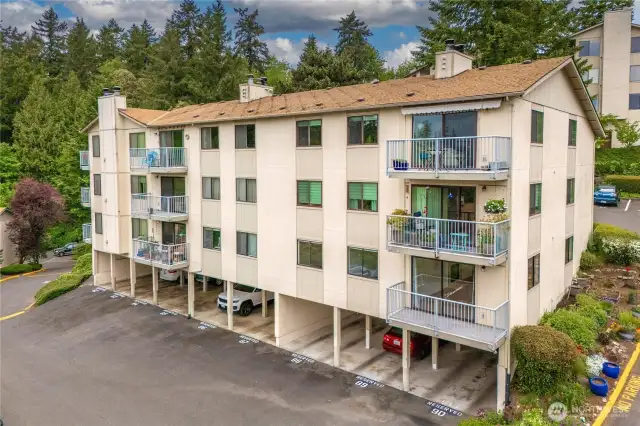 This unit includes covered parking located just below, along with a private storage room.