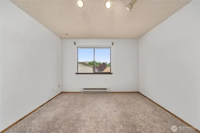 Another view of the primary bedroom.