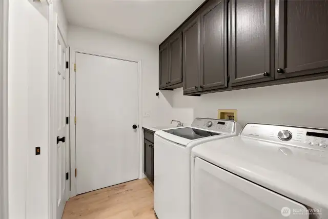 Laundry Area with Deep Sink Conveniently Located at the Garage Entry.