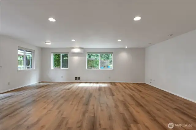 Great room with mini-split A/C for year-round comfort.  This oversized space offers endless possibilities!  Easily fits a full sectional or media area with plenty of room left for entertaining, pool table, home office setup, or even a cozy reading nook. A true multi-sue space ready to adapt to your lifesyle.